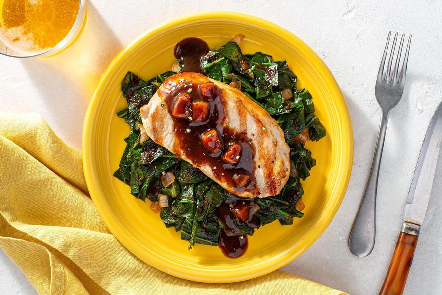 Southern-style pork chop with redeye gravy over spicy collard greens