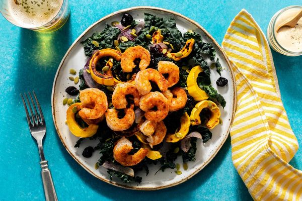 Harissa-spiced pork and kale salad with squash and dried cherries