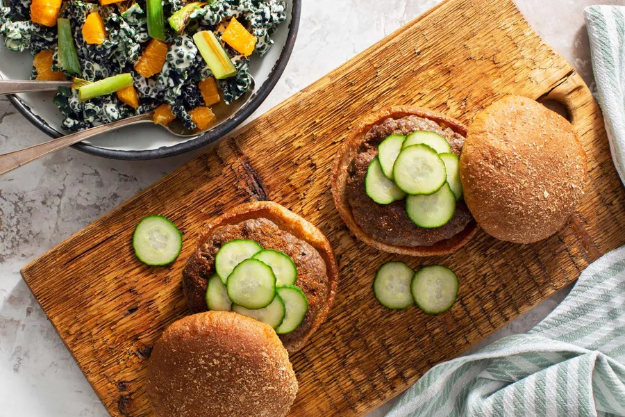 Teriyaki beef burgers with orange-kale salad and pickled cucumber