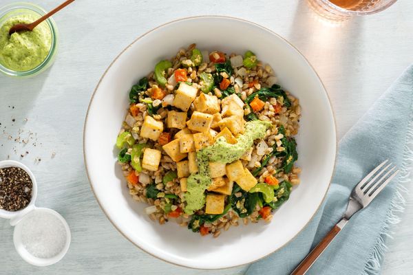 Salmon farro bowls with spinach and green goddess dressing