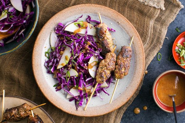 Korean beef skewers with ginger, pear slaw, and sesame seeds
