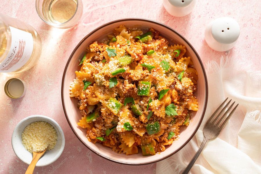 American chop suey with your choice of protein and pasta in tomato sauce