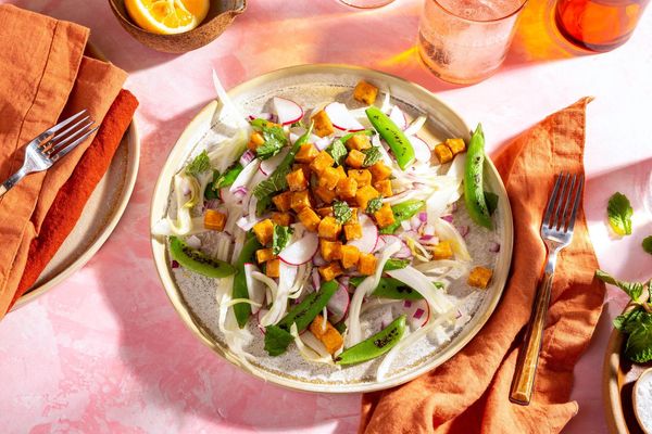 Fennel-spiced pork over snap pea and radish salad