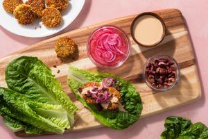 Tempeh falafel lettuce cups with Kalamata olives and pickled onion