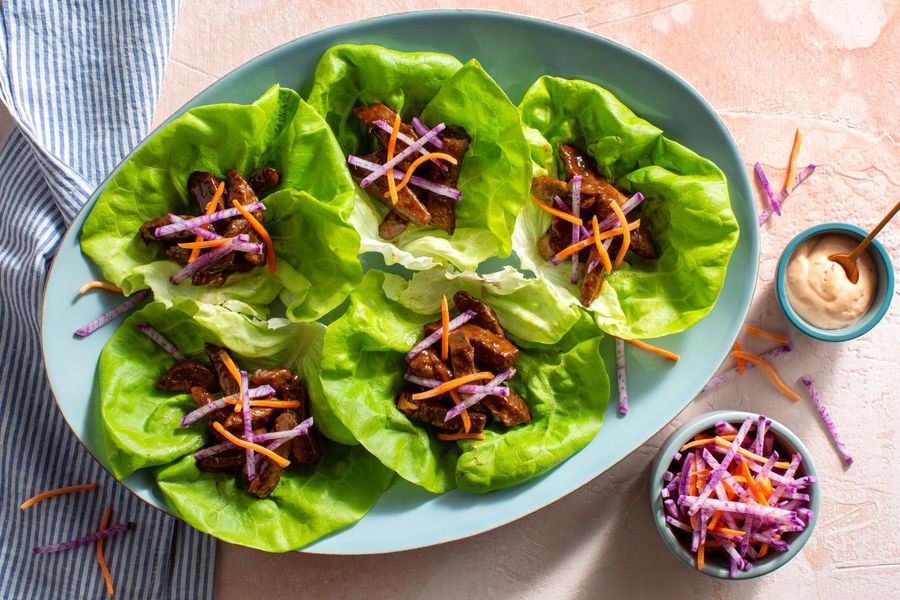 Hoisin steak strip lettuce cups with pickled daikon and carrots