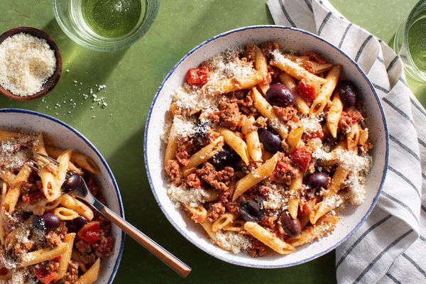 Penne rigate with ground chicken, tomato-olive sauce, and fresh ricotta