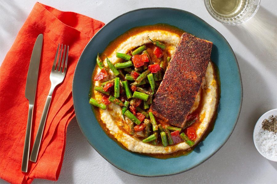 Creole-spiced salmon with tomatoey green beans and cheesy grits