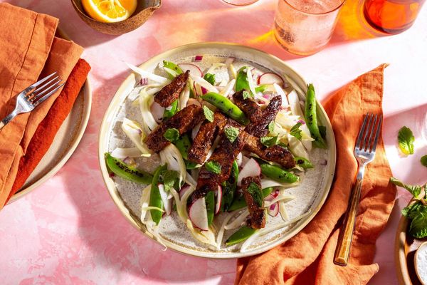 Fennel-spiced pork over snap pea and radish salad