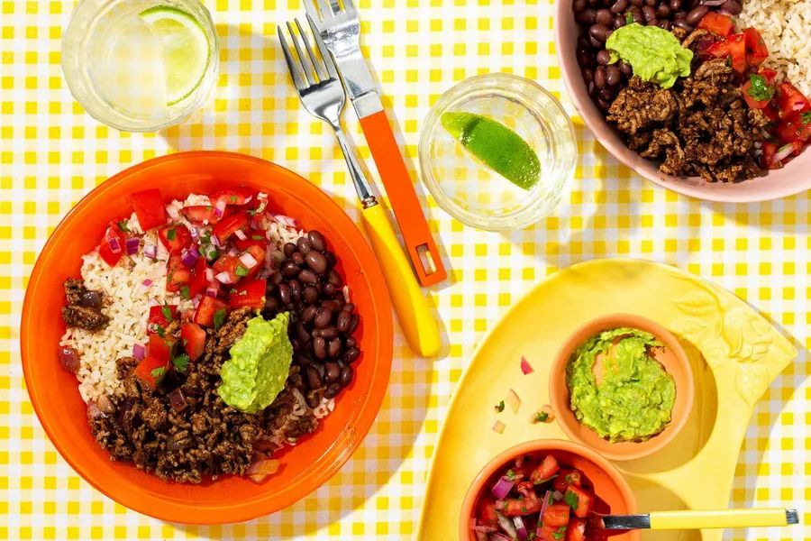 Taco bowls with brown rice, black beans, and pico de gallo