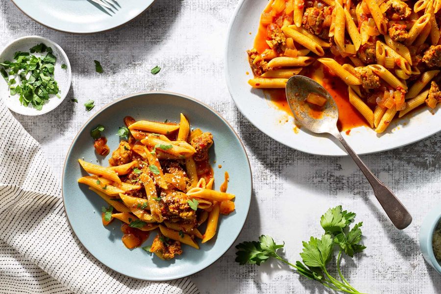 Fresh penne with Italian sausage, tomato sauce, and Pecorino Romano