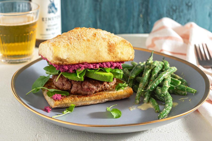Impossible™ Burger with avocado, watercress, and cashew-beet spread