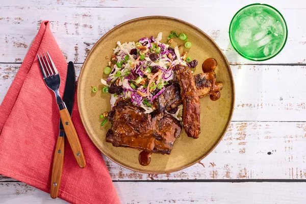 BBQ ribs and creamy coleslaw with dried cherries and pecans