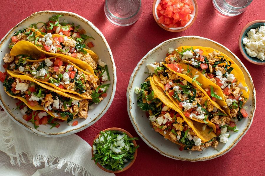 Street tacos with kale, tomato, and queso fresco