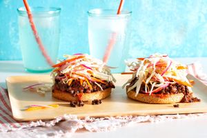 Open-faced lentil sloppy joes on whole wheat buns with coleslaw