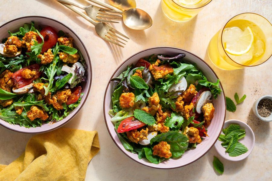 Larb salad with mushrooms, tomatoes, and fresh mint