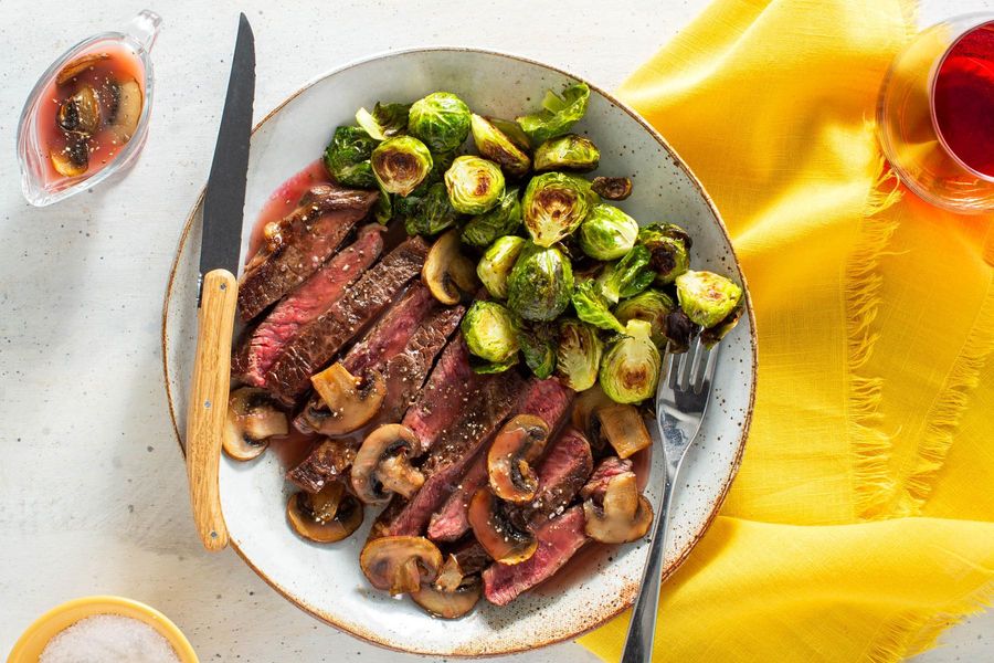 Black Angus rib-eyes with mushroom pan sauce and Brussels sprouts