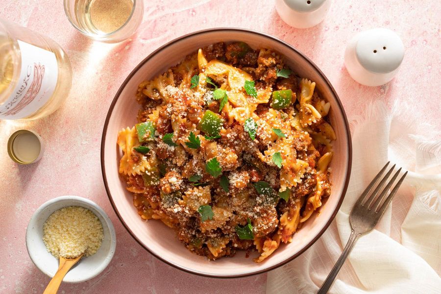 American chop suey with your choice of protein and pasta in tomato sauce