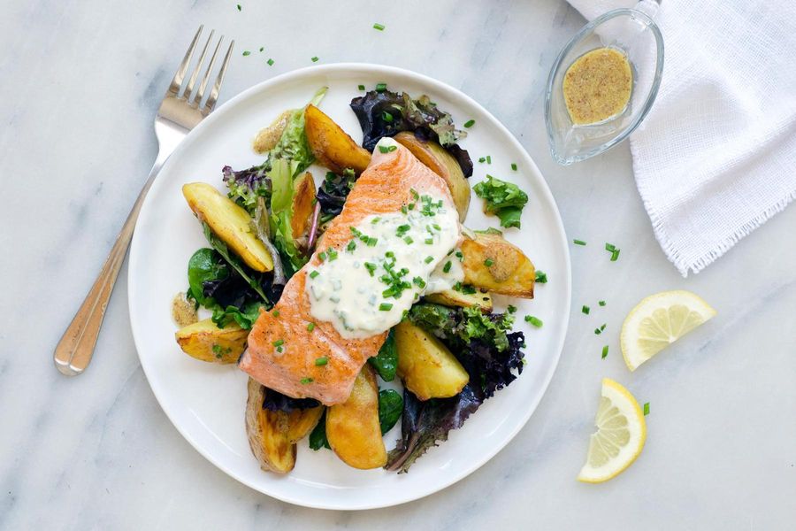 Salmon with roasted potatoes, field greens salad and chive creme fraiche 