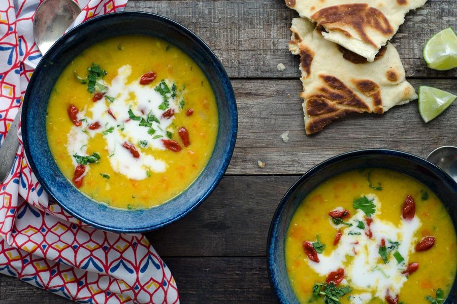 Curried red lentil soup with goji berries and naan