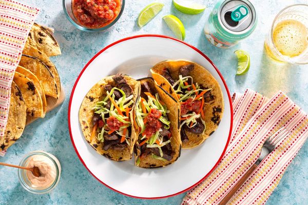 Salmon tacos with cabbage slaw, salsa roja, and chipotle yogurt